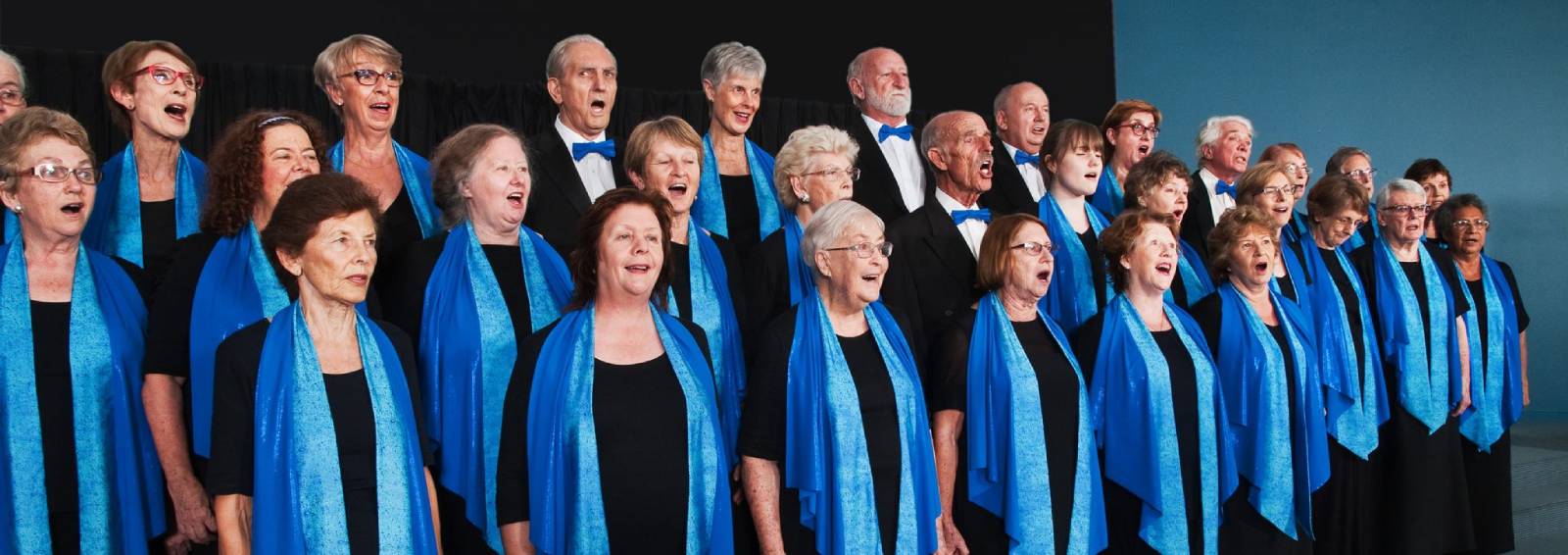 the sunshine coast choir performing in dress